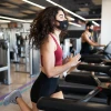 Woman exercising wearing mask